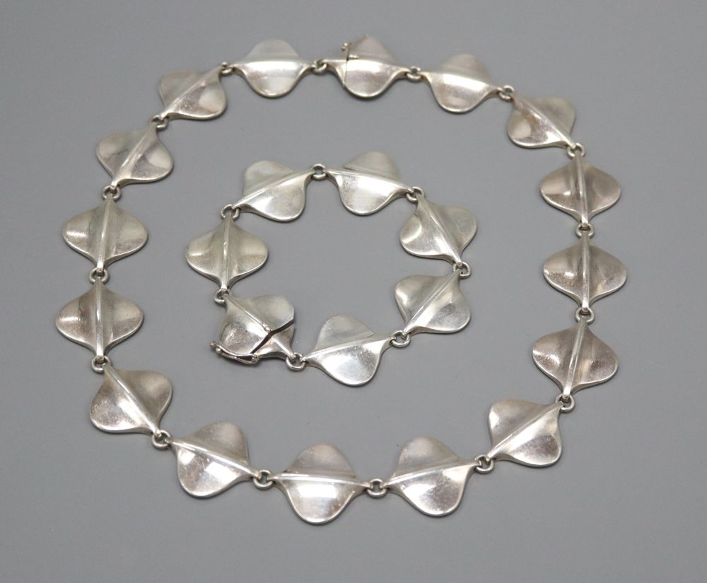 A Georg Jensen silver necklace with stylised oval links, number 176 and matching bracelet, number 176, 144 grams